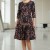 Rochie de ocazie Gisele din jerse negru cu imprimeu metalizat aramiu, maneci 3/4, croiala lejera