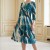 Rochie de zi Oliveira din barbie cu imprimeu abstract turquoise-auriu, maneci 3/4, croiala lejera