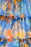 Rochie midi Raluca din voal albastru cu imprimeu portocaliu, căptușeală și volane